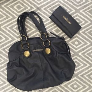 Reserved for @dritydrea03! Volcom bag and wallet!