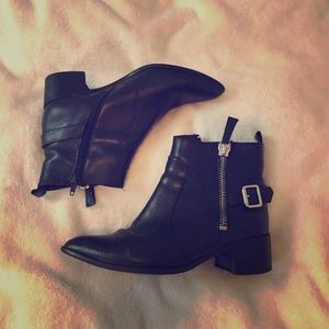 Spanish black leather booties with buckle detail