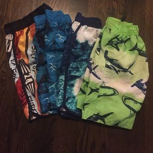 Four pairs of Gymboree boys swim trunks