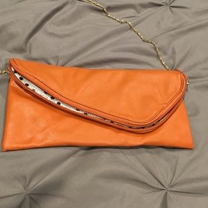 Orange wristlet with gold chain