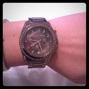 Chocolate Michael Kors watch with diamond border.
