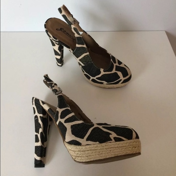 Animal Giraffe Platform Slingback Heels
Size 7
NEW