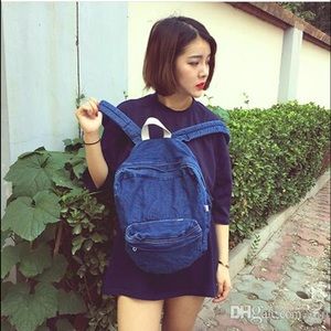 Dark wash denim backpack