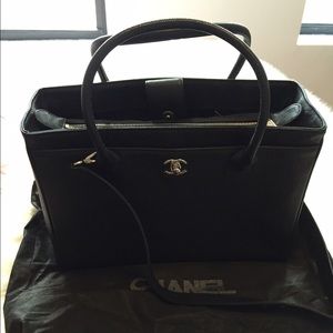 Black leather Chanel bag with cross body strap