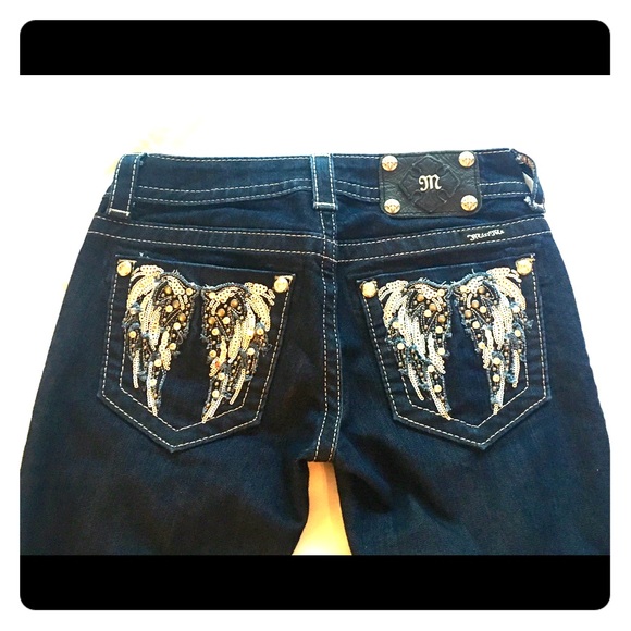 Miss Me jeans with wings on back pockets.