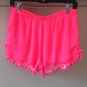 Neon pink Buddy Love brand pompom shorts