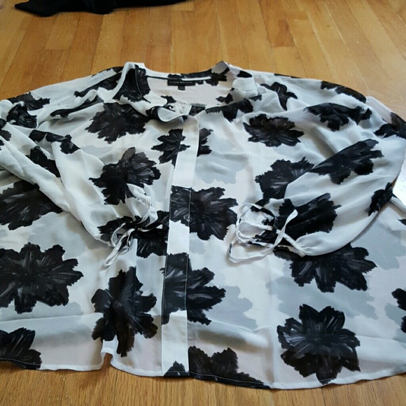 Worn one white blouse with black flower design