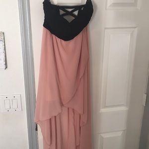 Peach and black strapless high/ low dress.
