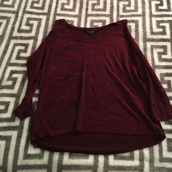 Sweater with shoulder cut out.
