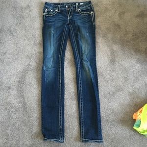Dark blue distressed miss me skinny jeans