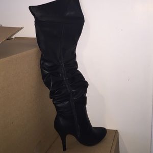 Black pull on over knee boots, size 8 1/2.. New