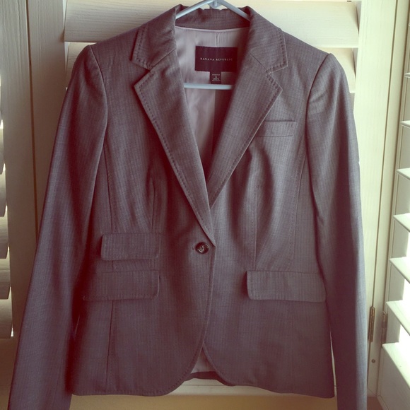 Gray pinstriped suit jacket with matching skirt