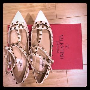 Valentino rock stud flats in white.