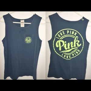 A navy tank top with neon pink letters
