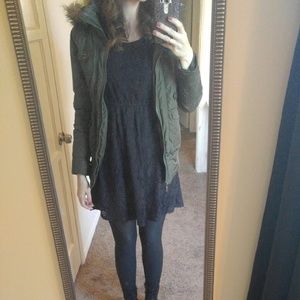 Olive green jacket with faux fur hood