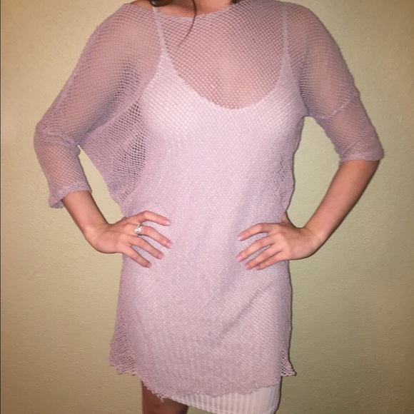 Nude bodycon dress with mesh overlay.