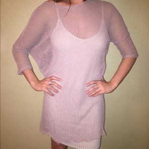 Nude bodycon dress with mesh overlay.