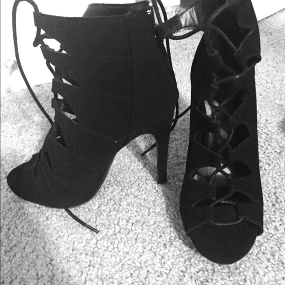 Black toe out lace up heels. Never worn