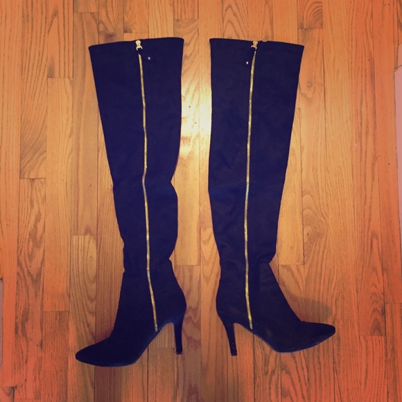 Over the knee black boots.