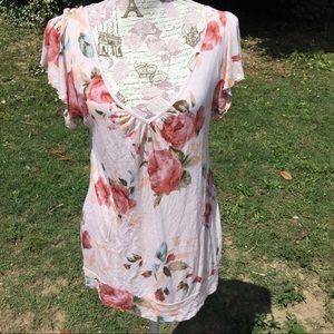 Pink floral blouse with lace accents