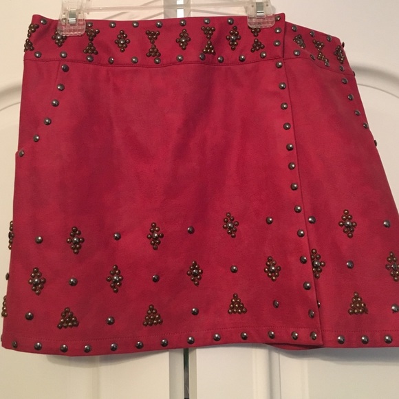 Very nice red skirt with gold and silver studs.