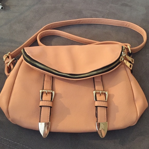 Peach and gold crossbody bag.