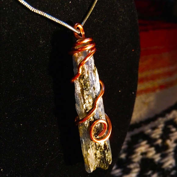 Handmade wrapped raw crystal Kyanite pendant.