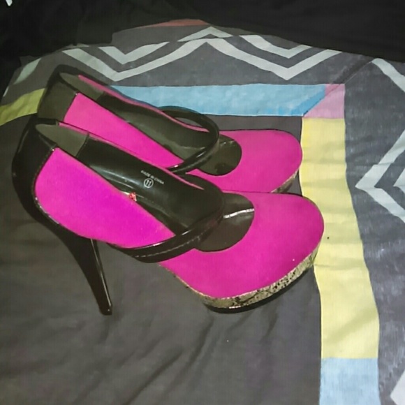 Fuschia heels with snake skin print bottom