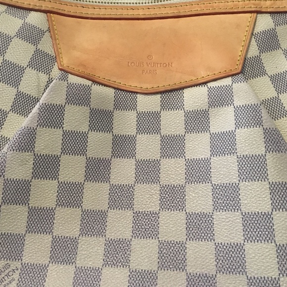 Authentic Louis Vuitton Siracusa cross body purse