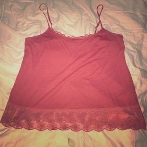 Red cami with lace along bottom and neck trim.