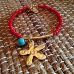 Red beaded bangle w/ flower charm
