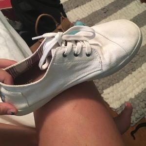 White TOMS sneakers