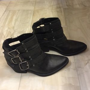 Black trendy boots with funky buckles