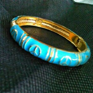 Gold and turquoise peace bangle
