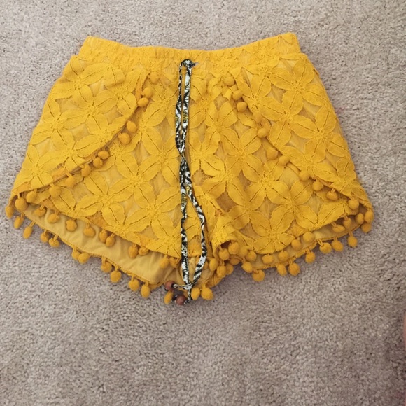 Adorable mustard color tasseled shorts!