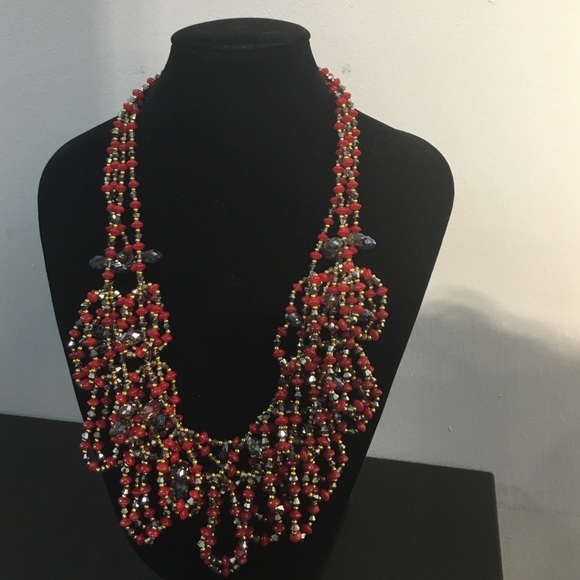 Multi- strand beaded necklace
