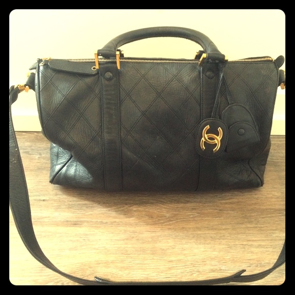 Authentic black leather Chanel mini duffel bag