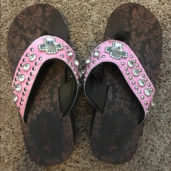 Pink and rhinestone flip flops