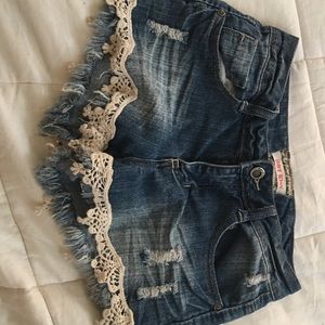 Denim shorts with lace on the bottom