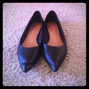 Maiden Lane pointed toe black flats.
