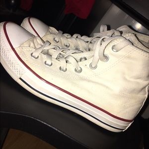 Off-white high top converse.