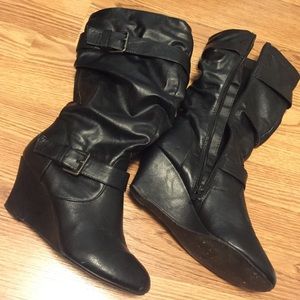 Black heeled leather boots