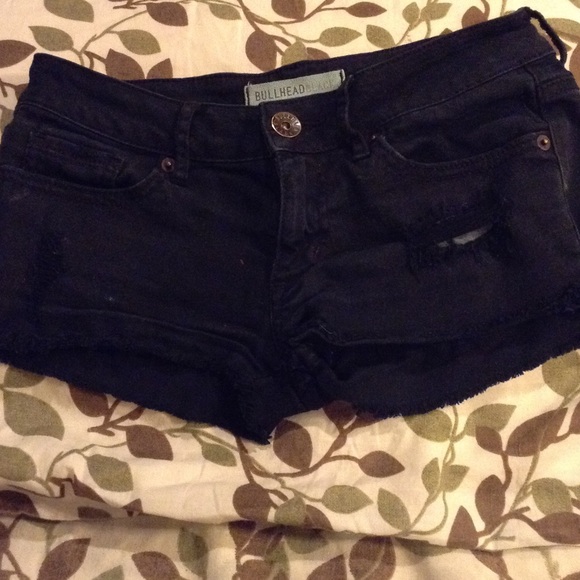 Black ripped low waisted shorts from Pacsun