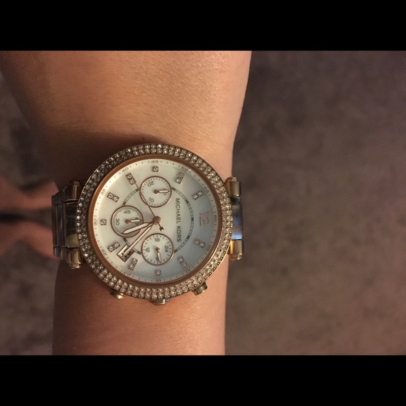 A rose gold Michael Kors watch