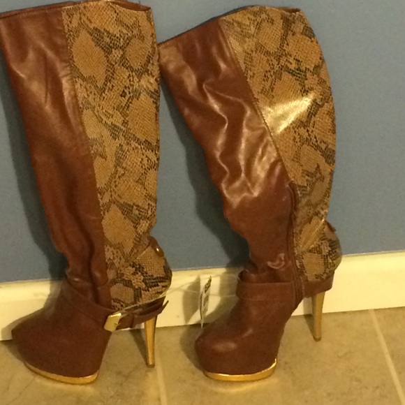 Brown knee high snake print boot