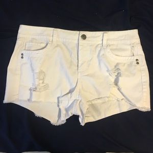 White ripped shorts