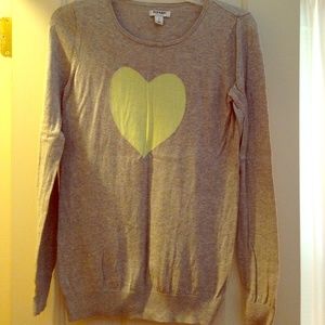 Gray long sleeve sweater with yellow heart.