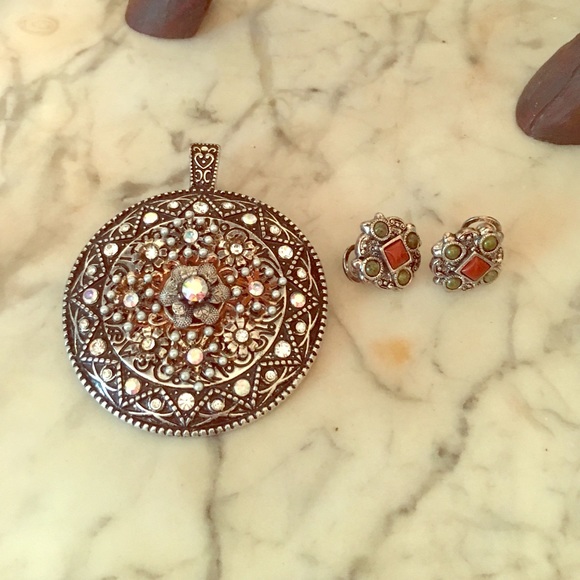 Silver Pendant with matching earrings.