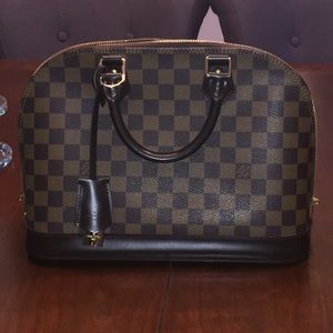 Authentic Louis Vuitton Damier style purse.
