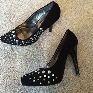 Black and stud pumps